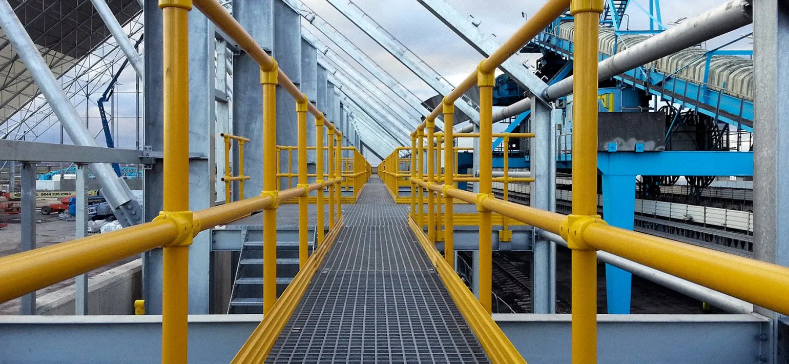 Our Industrial Handrail & Walkways range is intended to create safe access routes in an industrial environment. These products are typically installed in areas where there is a risk of falls, such as on elevated platforms or near machinery. They are typically made from steel or aluminium, and are available in a variety of sizes and shapes. Industrial walkways are typically designed to support the weight of a person and any equipment they may be carrying.

We stock a full range of products to allow safety on any site, these products include:


	Open steel flooring
	Steel handrailing
	Handrail bends
	Handrail clamps and brackets
	Open steel and durbar stair treads
	DDA steel products

